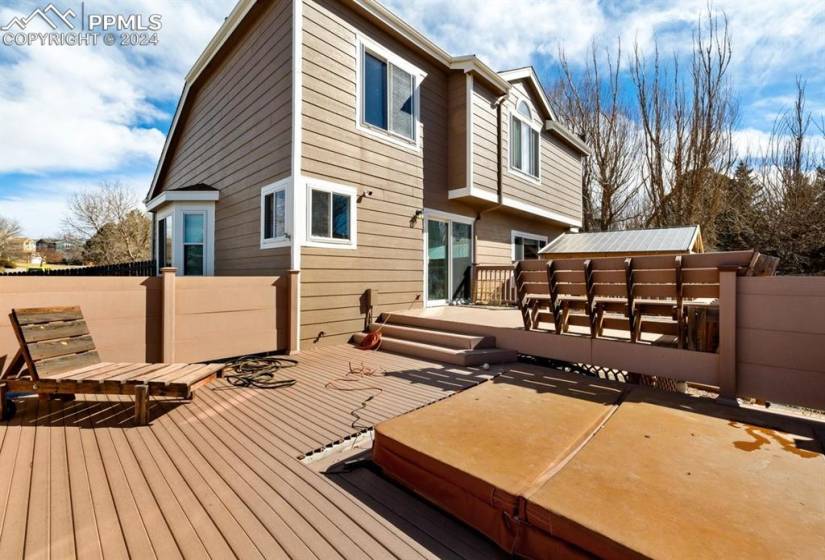 Private, fenced backyard w/ a composite deck, hot tub, oversized patio & gazebo for outdoor relaxation & fun.