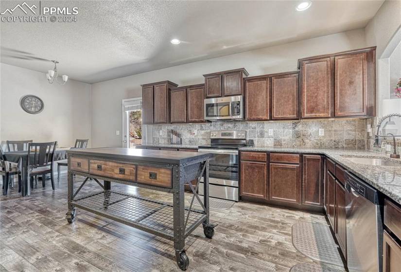 Large Eat-in Kitchen; Granite; Huge Walk-in Pantry; Stainless steel appliances; Perfect flow to all areas of the house...SEE 3D Tour!