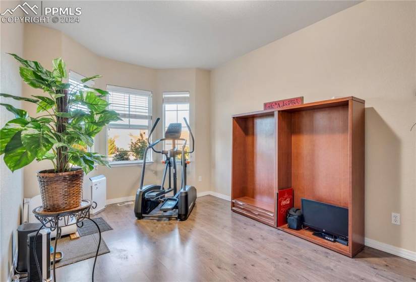 This front room makes a great home office or exercise room with views to the front.