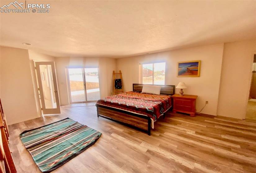 Bedroom featuring light hardwood / wood-style floors and access to exterior