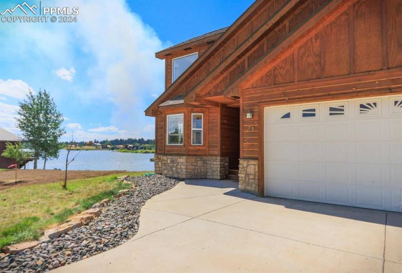 View of property exterior with a water view