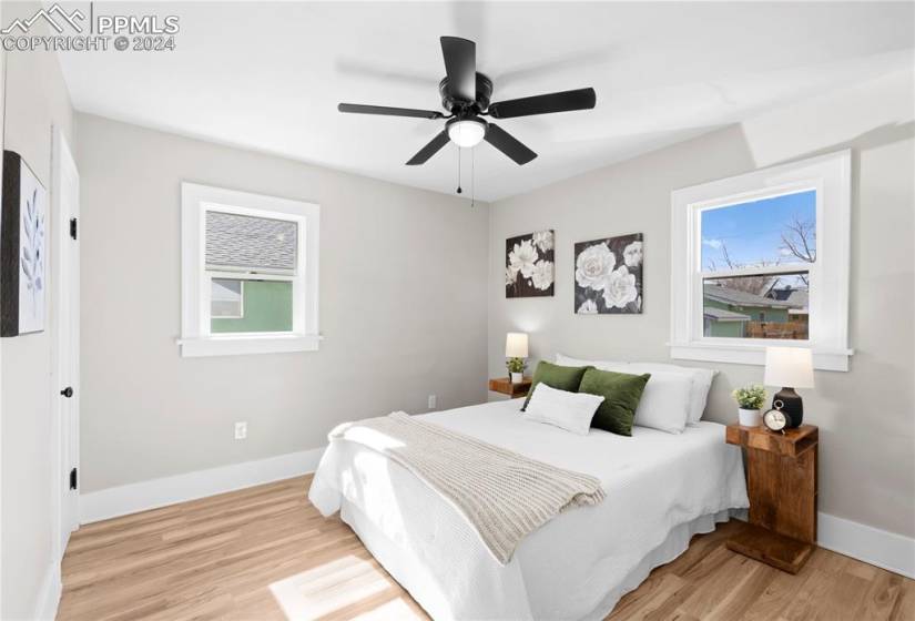 Bedroom featuring ceiling fan and light wood-type flooring
