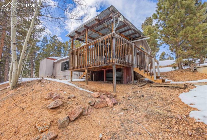 Rear view of property with a deck