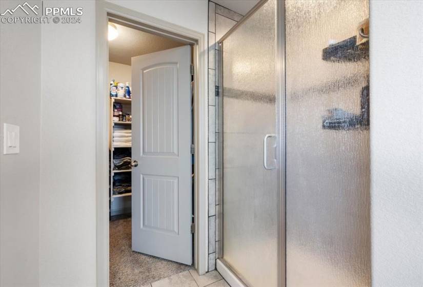 Separate shower and walk-in closet in the Primary Upper Level Bathroom.