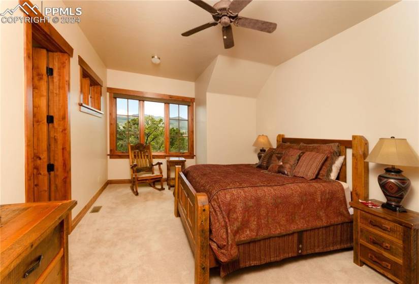 Upstairs second Bedroom with ceiling fan, luxurious carpet, high ceiling, sitting room with tremendous views!