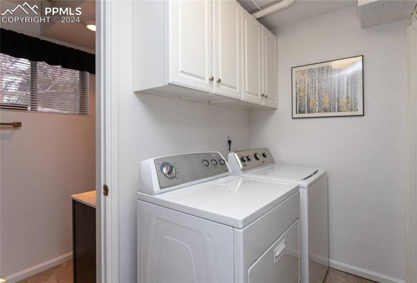 Laundry Room on Lower Level has ample Cabinet Space