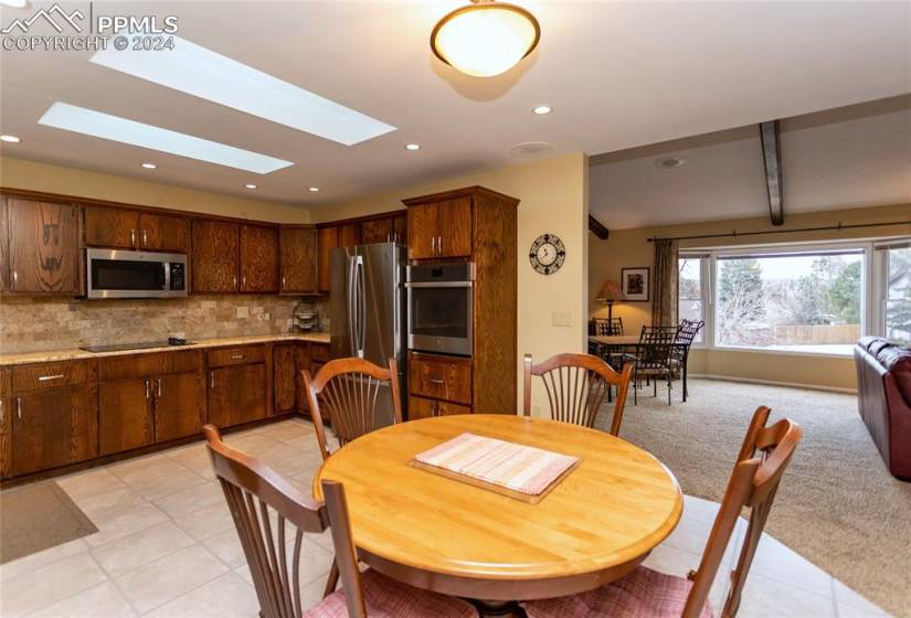 Light and Bright Kitchen has tile floor and skylights