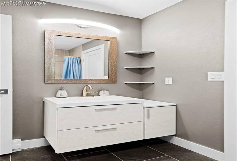 Bathroom featuring tile floors and oversized vanity