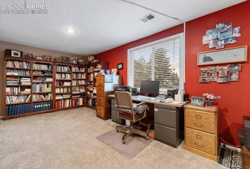 The family room is currently used as double offices plus a cozy living area. However you'd like to use the space, there is PLENTY of room to spread out.