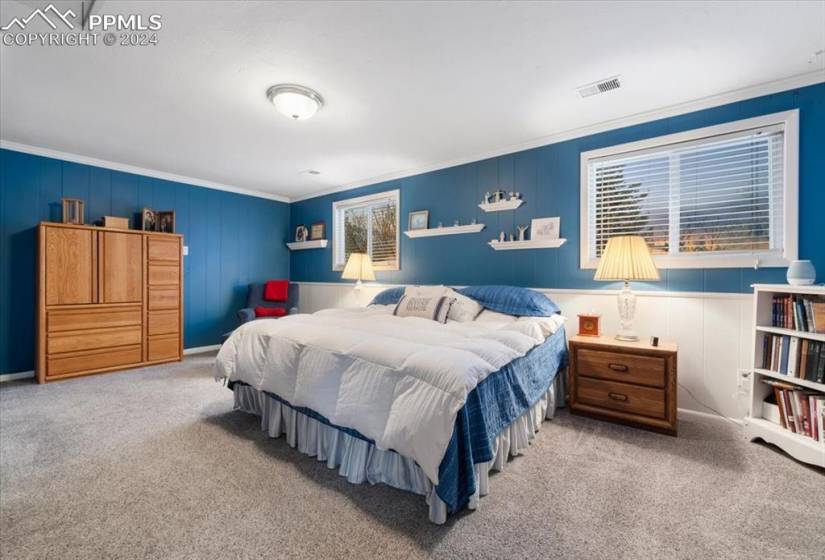 This basement-level bedroom is big, bright and lovely.