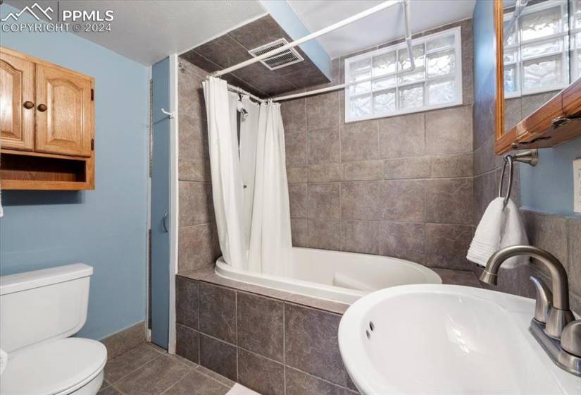 This basement-level bathroom includes one of the deepest soaking tubs we have seen.