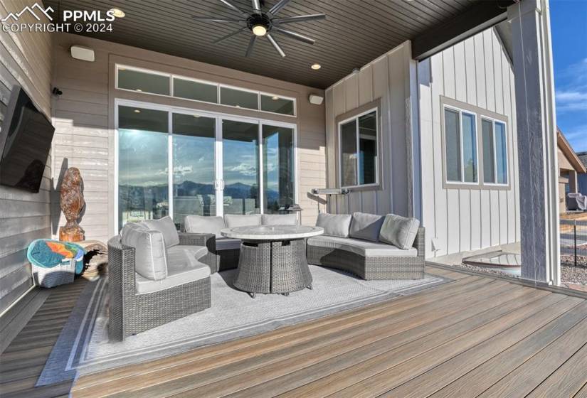 Deck with outdoor lounge area and ceiling fan