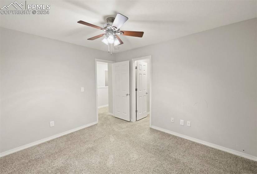 Bedroom #3 with light colored carpet and ceiling fan