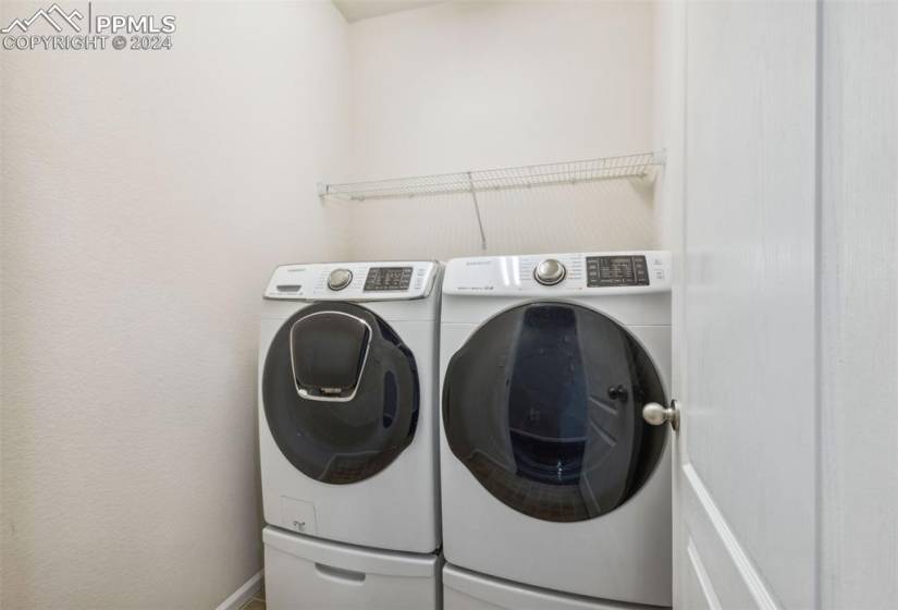 Laundry room featuring separate washer and dryer