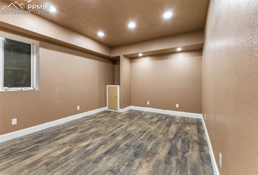 extra  room with dark hardwood / wood-style flooring