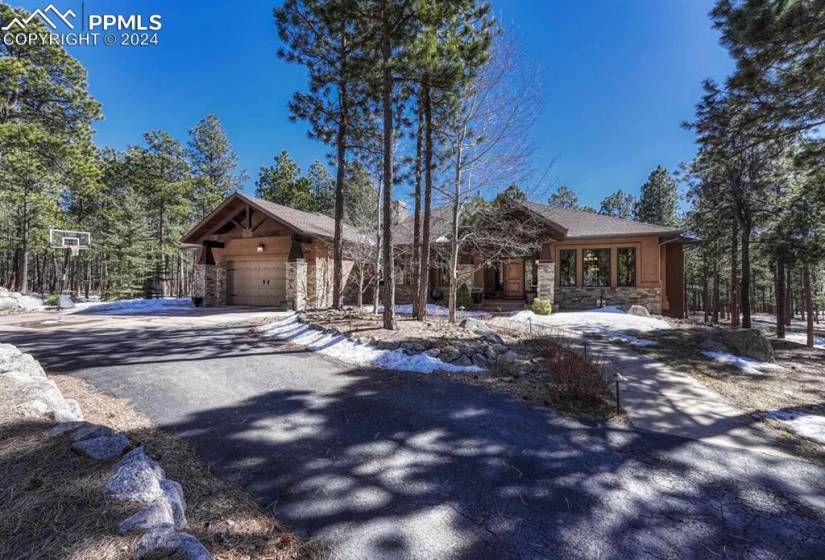 Striking View of front of property featuring a garage entry