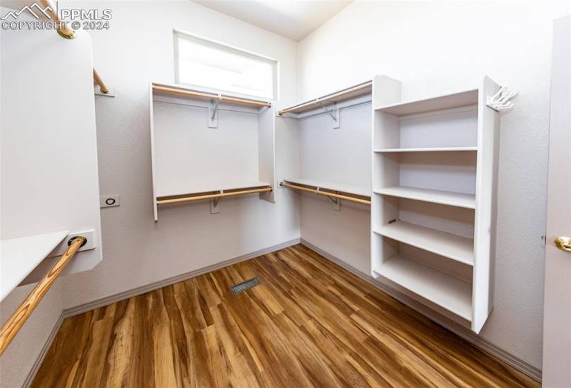 Large walk-in closet in primary bedroom with ample room.