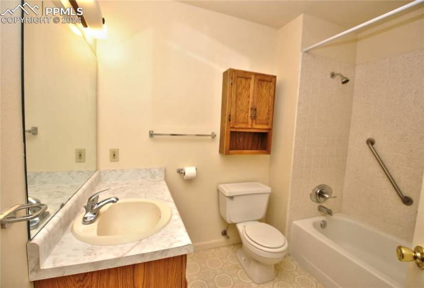 Full bathroom featuring vanity, flooring and tub/shower combo