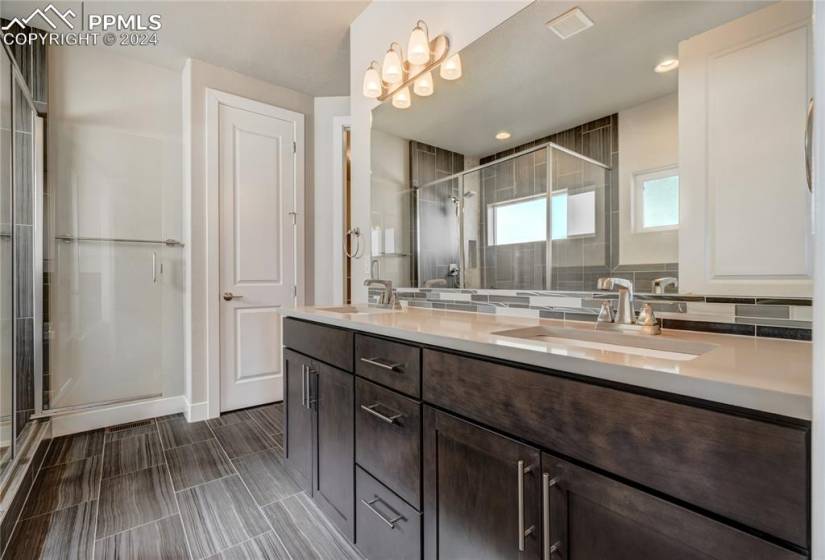 Owner's Ensuite with Dual Undermount Sinks, Large Vanity, Soaking Tub, Walk-in Shower, Linen Closet + Walk-in Closet