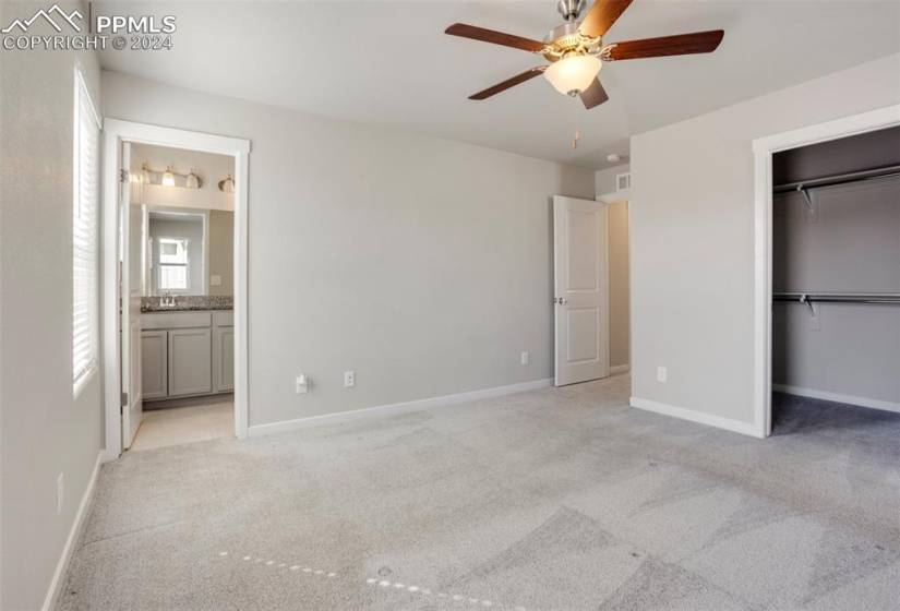 Upper level master bedroom boasts an adjoining bath and walk-in closet.