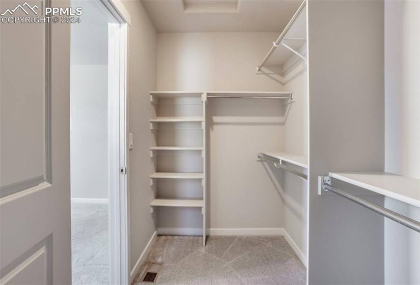 This awesome walk-in closet in the master suite provides so much space for all of your belongings!