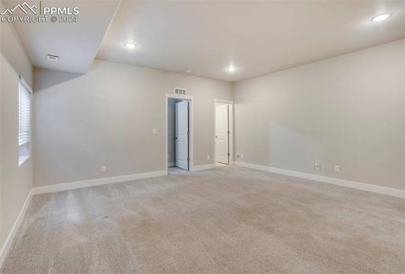 The basement family room grants access to the 4th bedroom and a full bath.
