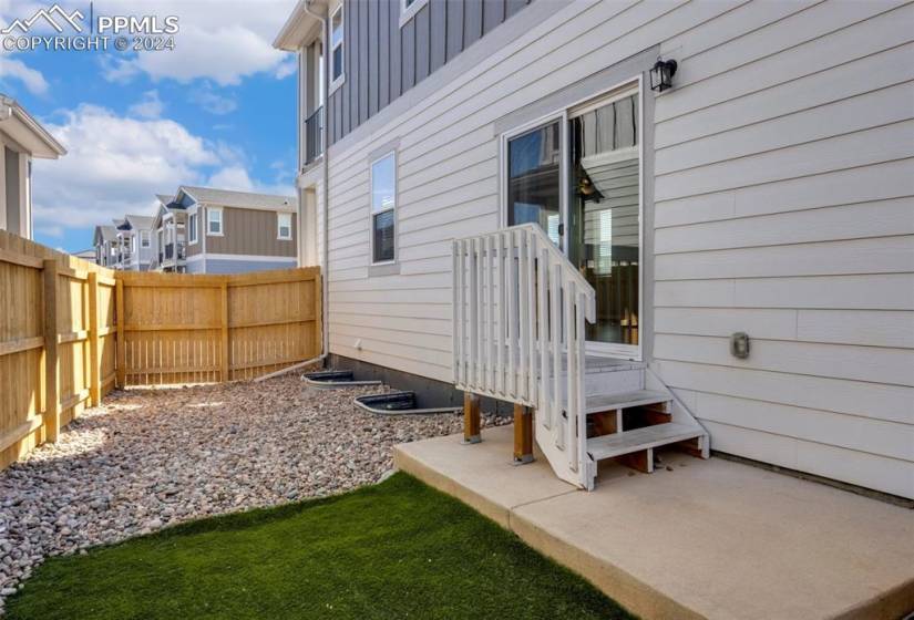 The kids and pets will enjoy the side yard off the dining area.
