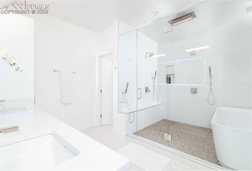Master bathroom with wet room spa, heated floors, double under lit vanity, custom cabinets.