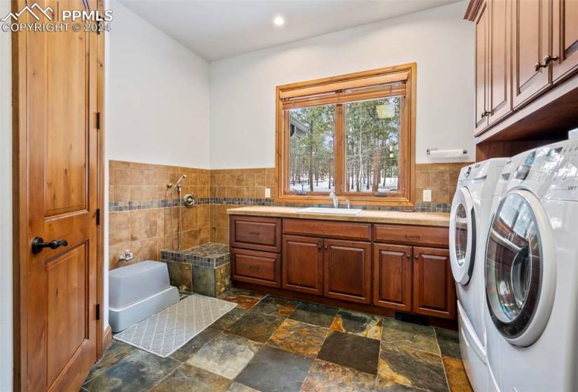 Large laundry/mud room combo with sink and dog wash