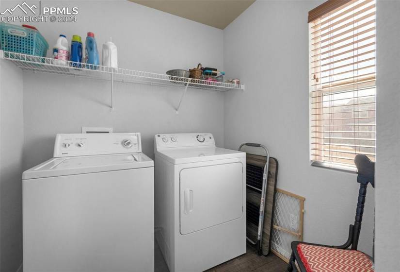 Laundry room with included Washer/Dyer and window