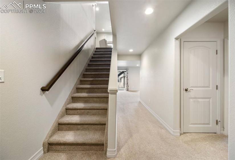 Stairway leading from great room into walk-out basement