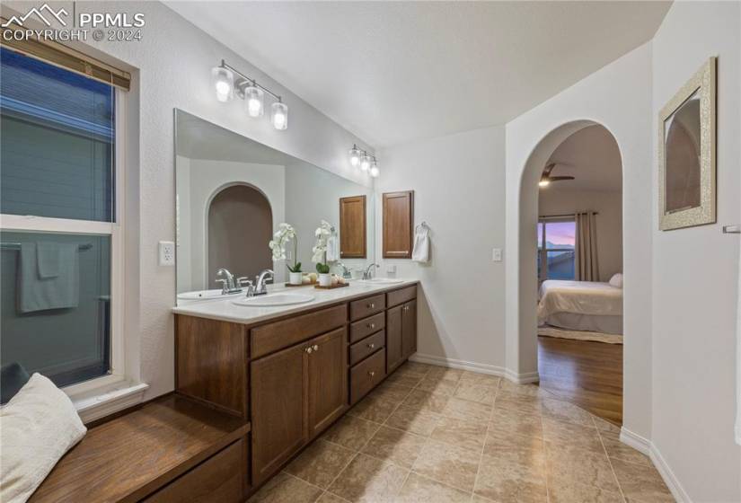 Bathroom featuring hardwood / wood-style flooring and double vanity