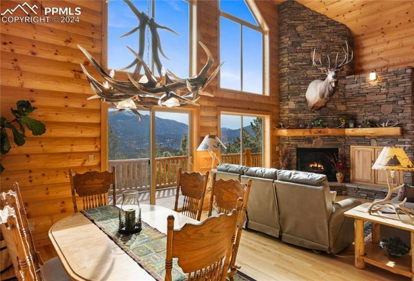 Dining space featuring an antler chandelier, and mountain views