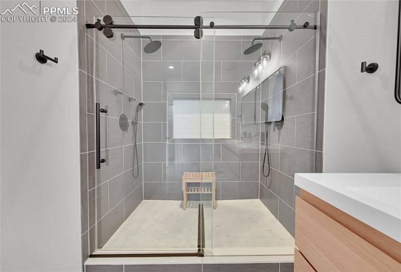 Bathroom with walk in shower and vanity