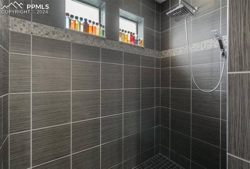 Master-bathroom shower with floor to ceiling tile