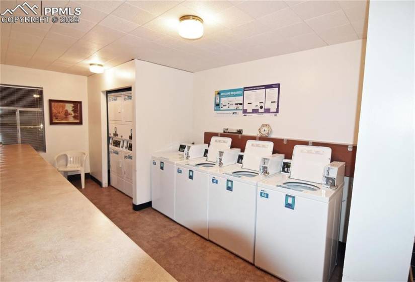 Laundry room featuring stacked washer / drying machine and separate washer and dryer