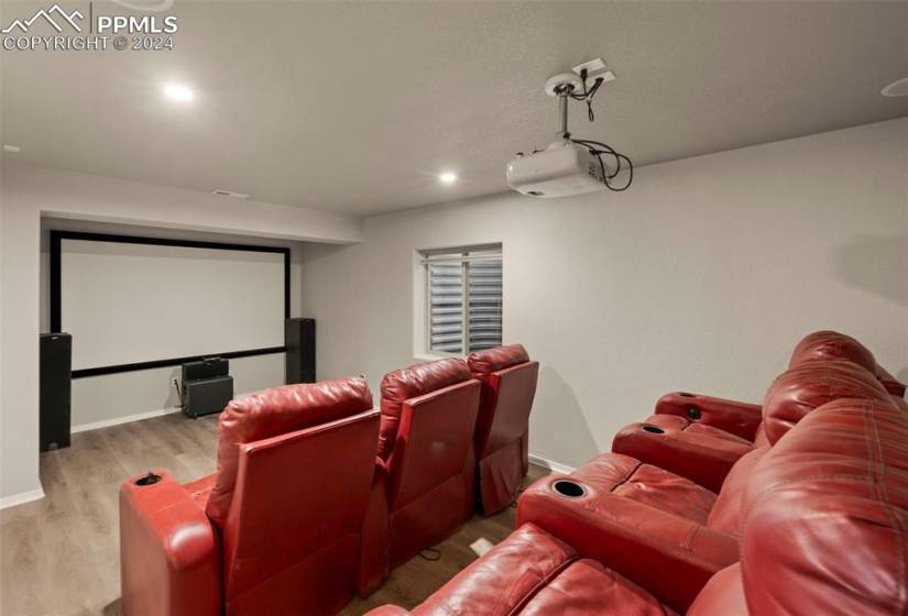 Home theater featuring light hardwood / wood-style flooring