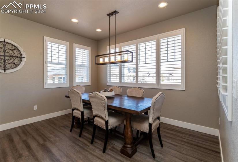 Large dedicated dining area with plantation shutters and natural light