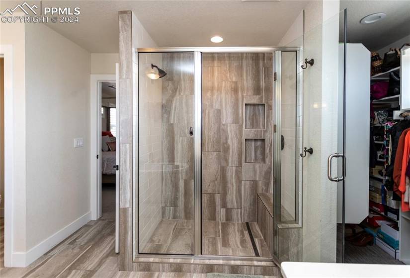 Master bathroom with shower and walk in closet