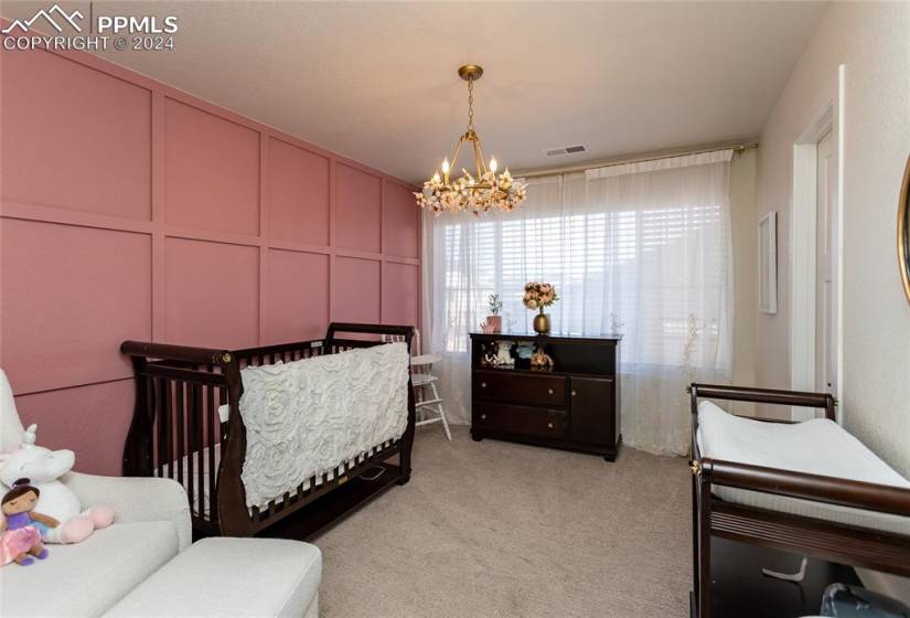 2nd bedroom across from the master bedroom with walk in closet.  Princess chandelier is excluded