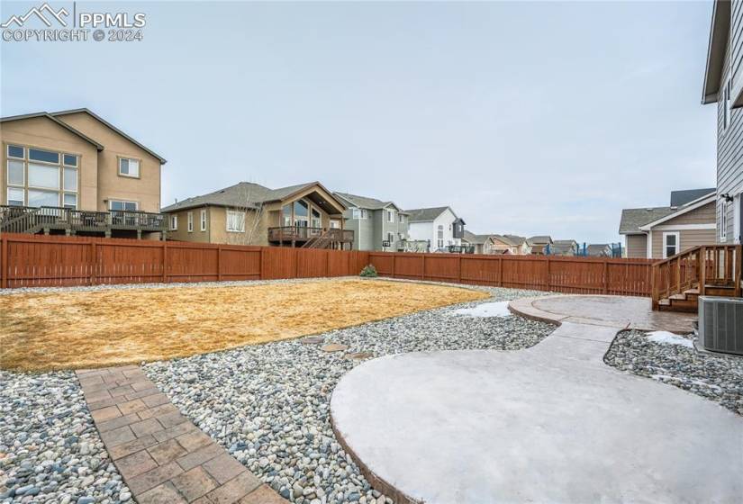 Fully Landscaped, 0.18-Acre Lot | Custom Stamped + Stained  Rear Patio + Extension to Additional Patio Area | Automatic Sprinkler System | Newer Sod in Rear (2022)