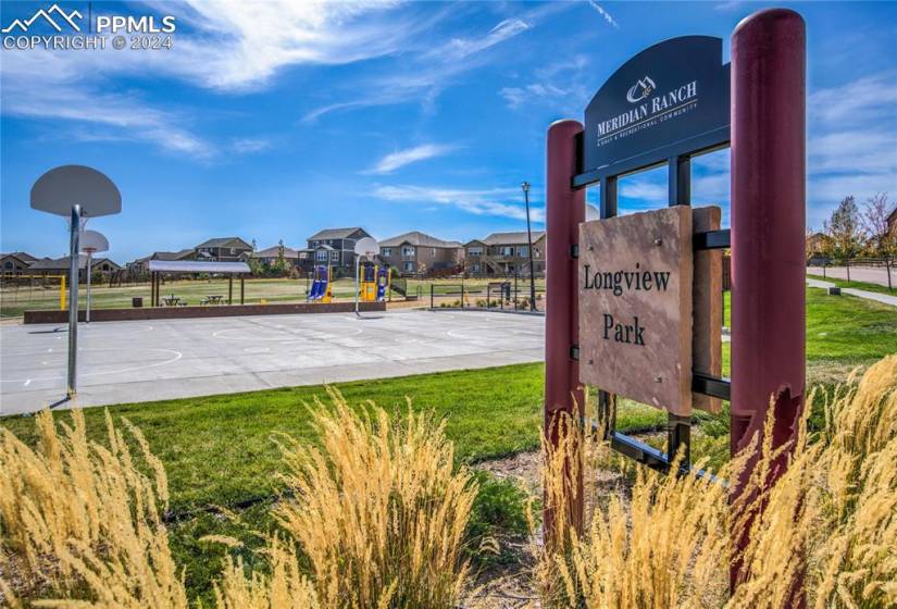 Longview Trail + Longview Park featuring a multi-purpose court for basketball games or inline hockey, playground, pavilion with picnic tables and open space for sporting events and activities
