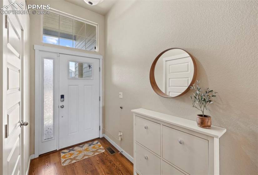 Entry with coat closet and console included with hidden shoe storage