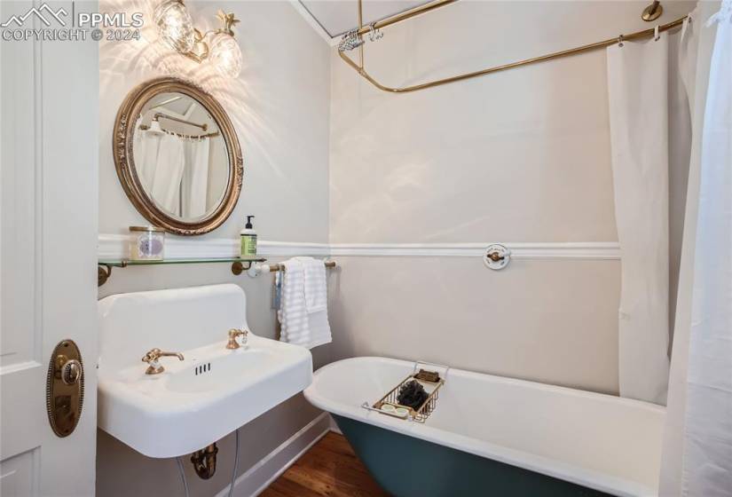 Bathroom featuring sink and hardwood floors