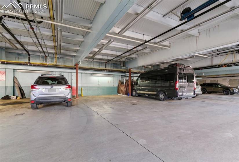 Two car parking in Oversized heated community garage with 2 spots plus one parking space outside