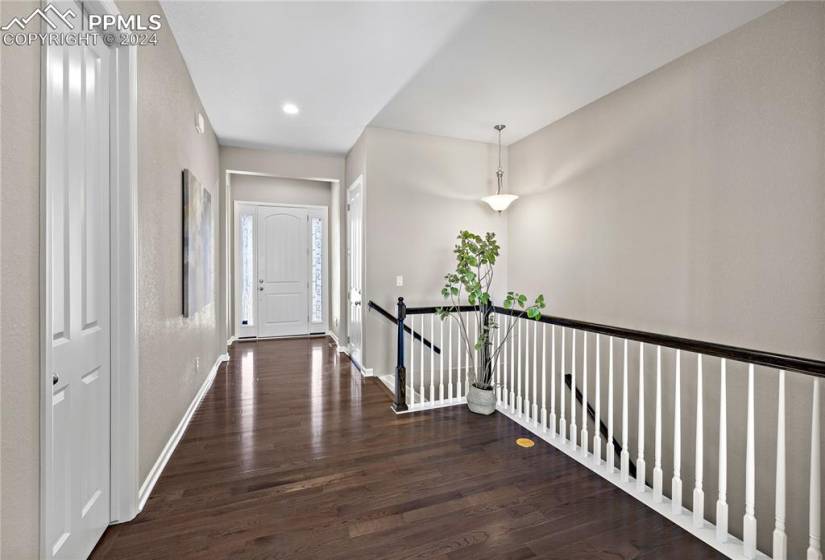 Foyer with real wood flooring