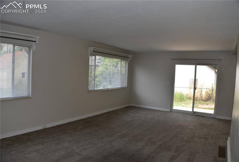 Bedroom with dark hardwood / wood-style floors