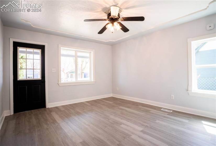 Foyer entrance featuring ceiling fan and hardwood / wood-style flooring