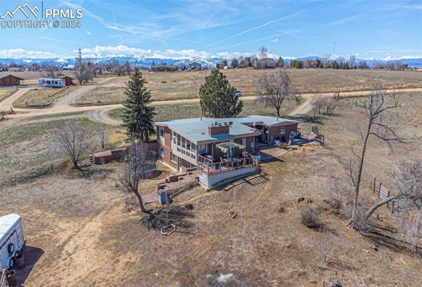 Birds eye view of property with a rural view