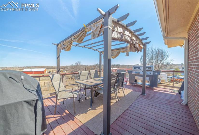 Deck featuring a pergola